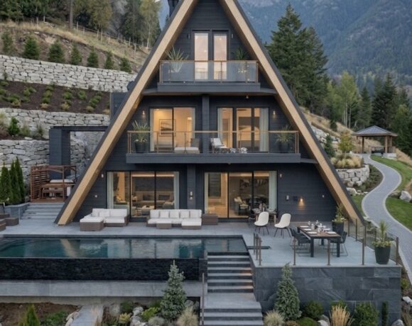 Exterior of an upscale A-frame mountain villa with infinity pool